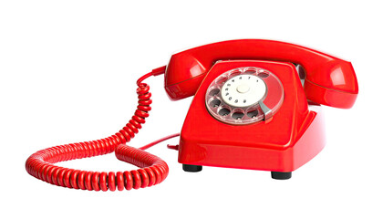 A classic bright red rotary dial telephone isolated against a black background