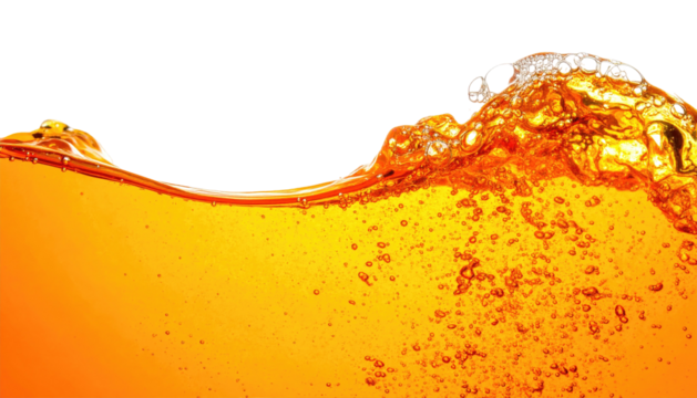 Close-up of amber liquid forming a wave, with bubbles rising. Black background