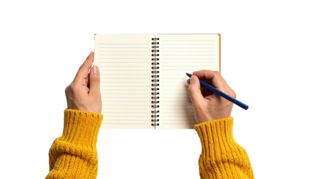 Person in yellow sweater writing with a blue pen in an open, spiral-bound notebook