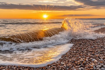 Golden sunset over a foamy wave crashing on a pebbled beach