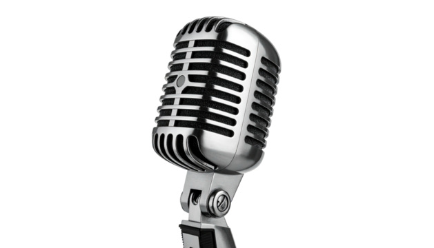 A vintage, chrome microphone stands prominently against a stark, black background