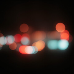 Colorful blurred bokeh lights in blue, red, orange, purple, and white on dark background, isolated effect for festive, artistic, or atmospheric design projects