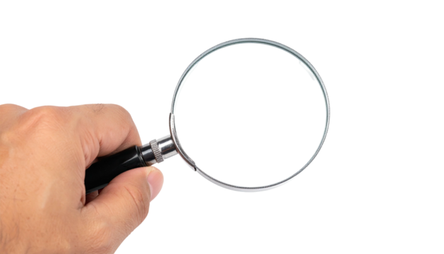 A hand holding a magnifying glass against a black background, ready for inspection