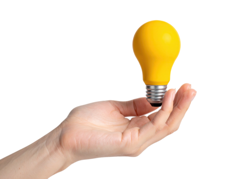 A hand holding a glowing yellow lightbulb against a stark black background