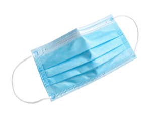 Close-up view of a light blue surgical face mask with ear loops against black