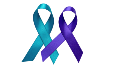 Two silk ribbons, teal and purple, crossed against a black backdrop