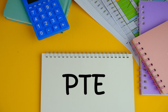 pte - text on wooden cubes stationery. Pearson Test of English, a computer-based English language proficiency test 
