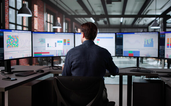 Elderly Analyst Monitoring Corporate Growth Using Business Analytics Dashboard - Powered by Adobe