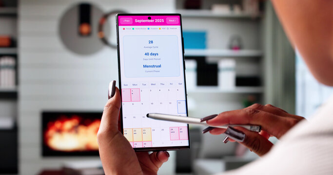 African American Woman Tracking Menstrual Cycle
