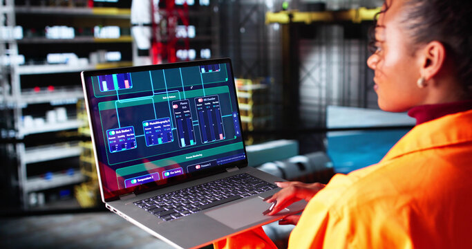 Skilled Young Woman Ensuring Proper Operation - Powered by Adobe