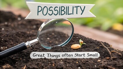 Magnifying glass examining new plant seedling in fertile soil