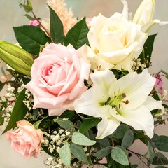 Delicate pastel bouquet of roses and lilies