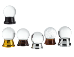 Seven clear, spherical globes atop varied-colored bases, arranged on a black backdrop