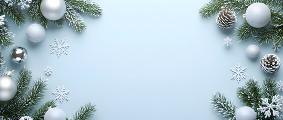 Christmas background with white and silver decorations on a light blue surface, a flat lay composition, top view.