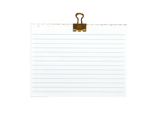 A ruled white notepad sheet held by a gold-colored metal clip against a black background