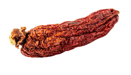 A close-up shot of a dehydrated, wrinkled, reddish-brown chili pepper