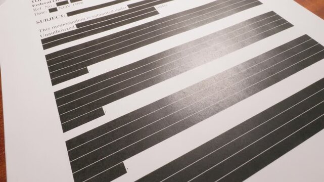 Redacted Confidential Documents Spread Across Table Surface 1