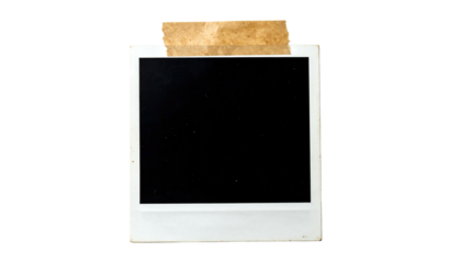 Empty instant camera photo with tape attached at the top, isolated on black