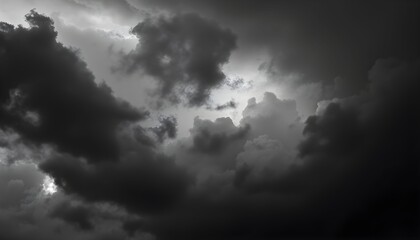 Dramatic black and white image of ominous storm clouds gathering in the sky.