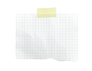 A torn, grid-lined paper square secured with a yellow tape piece, set on black