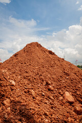 Excavation progress earth mound construction site outdoors wide angle urban development