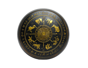 A round object with a zodiac wheel, gold accents, and aged, weathered texture