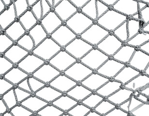 Fototapeta premium Close-up of a gray rope net with diamond-shaped openings against a black void