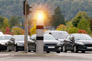 Stationary surveillance speed camera, traffic control for speeding, collecting traffic jam information and offenses, car flashed on road, Trier, Germany