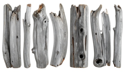 Seven pieces of weathered wood, arranged side-by-side, isolated on black