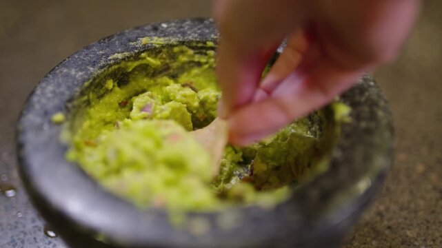 close up of fresh guacamole on chips