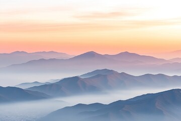 Fototapeta premium Misty mountain ranges at dawn