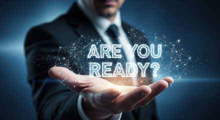 Business Man Holding Futuristic "Are You Ready?" Message, Representing Innovation, Technology, and Preparedness for the Future of Business