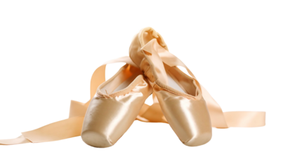 Ballet pointe shoes with satin ribbons on a white background.