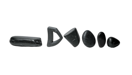 Black stones arranged in a row on a white background.