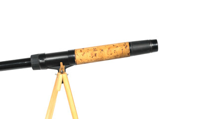 Close up of a fishing rod with a cork handle on a tripod isolated on a white background.
