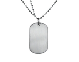 Close-up of a silver dog tag pendant hanging from a chain, black background