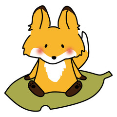 大きな落ち葉に乗るキツネ