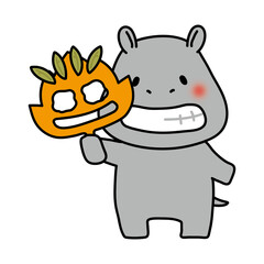 落ち葉のお面を持つカバ