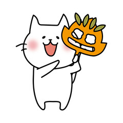 落ち葉のお面を持つ白い猫