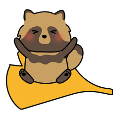 大きな落ち葉に乗るタヌキ