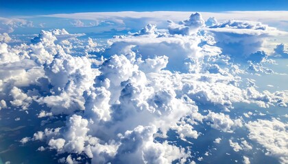 View of clouds from an airplane, fluffy and white