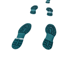 Sole prints in teal against a stark black backdrop, creating a sense of movement