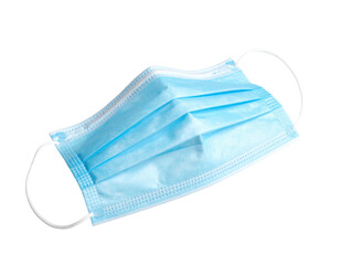 Light blue surgical mask with white ear loops isolated on a black background