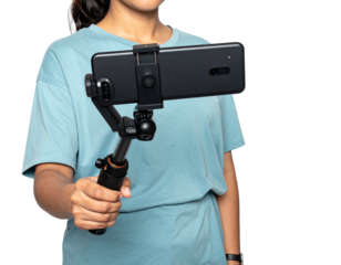 Person holding a smartphone in a stabilizer, showing off video recording