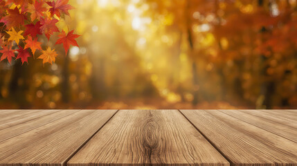empty wooden table with autumn leaves against blurred fall forest background