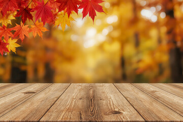 empty wooden table with autumn leaves against blurred fall forest background