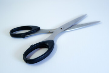 Black scissors isolated on white background, cutting tool for office, craft, or home use.
