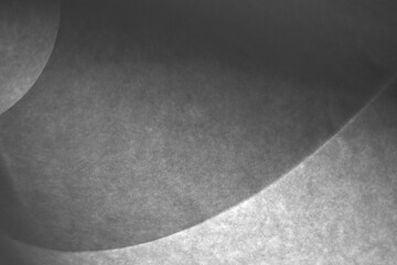 Folded paper abstract shadows and shapes. Artistic abstract black and white folded paper background with creative light and shadow contrast.