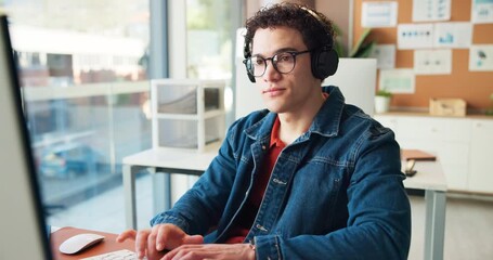 Computer, happy man and listening to music in office with headphones, data analysis and productivity. Smile, analyst and person in workplace with wireless tech, online radio and streaming audio.