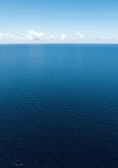 Fototapeta premium Expansive deep blue ocean water stretching to the distant horizon, showcasing the vastness and serene beauty of Earth's marine environment ,ripple ,nature ,clear